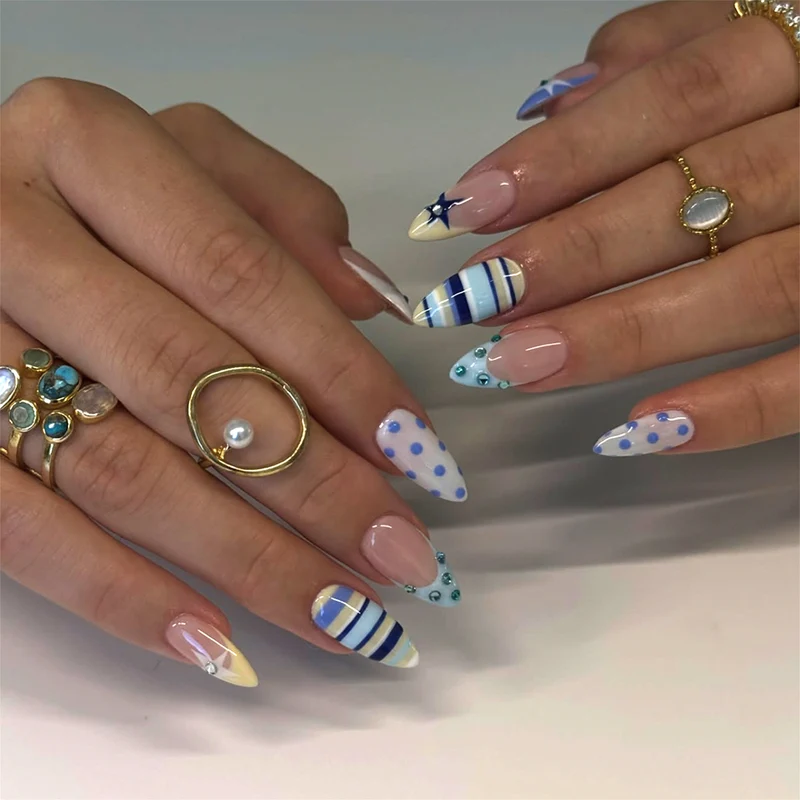 Artful stiletto nails with maritime designs Stornfield