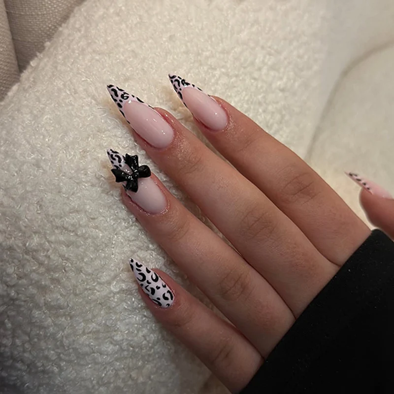 Artful Stiletto Nails with Leopard Print and Bow Accent Stornfield