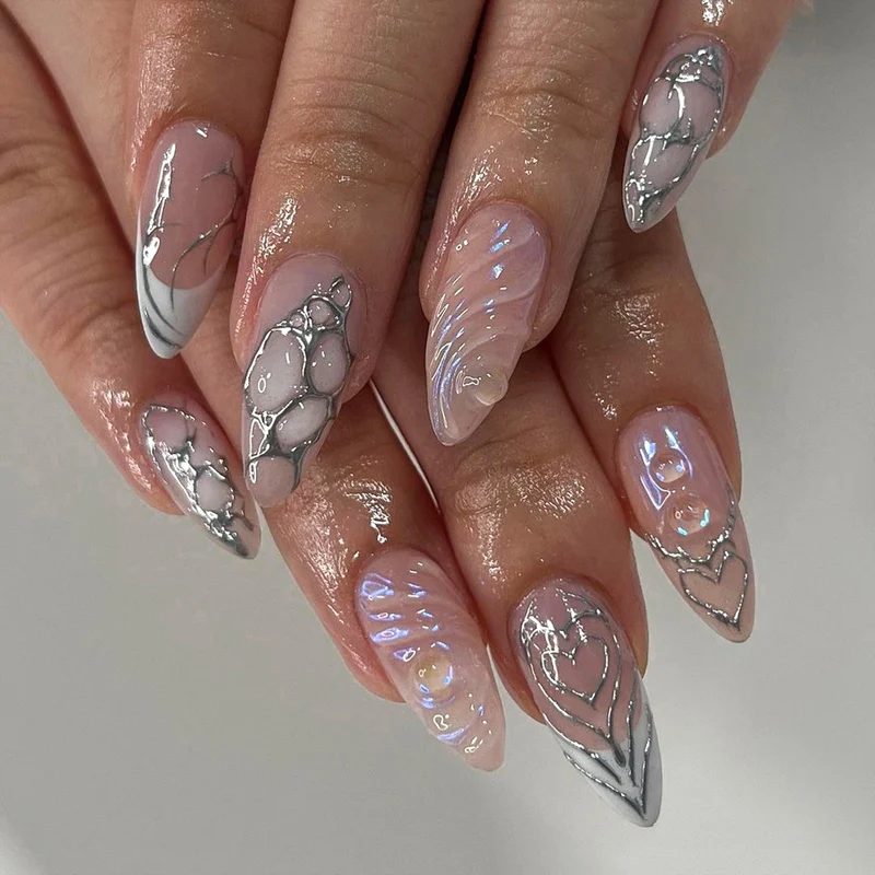 Artistic stiletto nails with holographic effects Stornfield