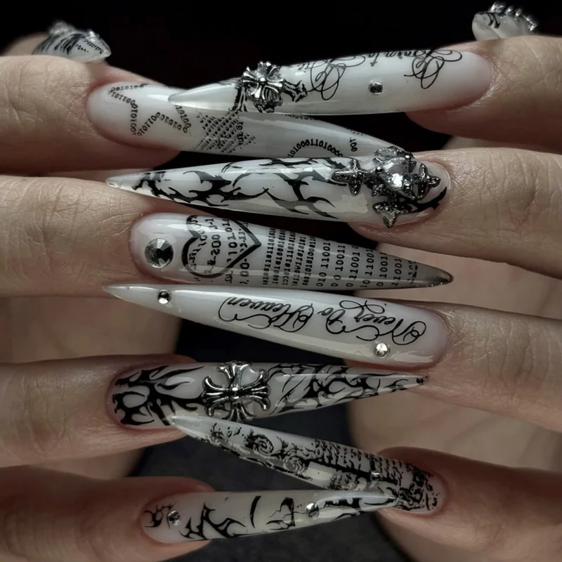 Artful stiletto nails with gothic pattern and embellishments Stornfield