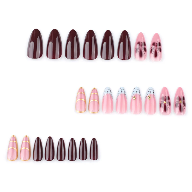 Artful Stiletto nails with gold accents and decorative floral designs Stornfield
