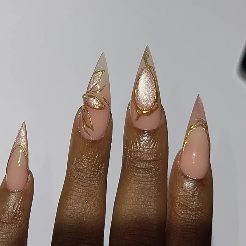 Artful Stiletto Nails with Gold Accents Stornfield