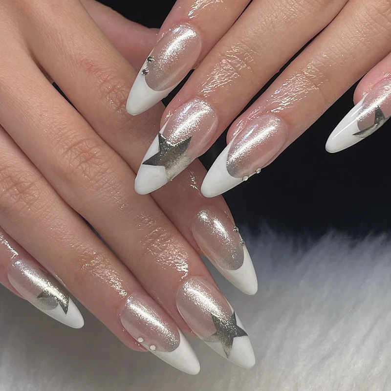 Artful stiletto nails with glitter and star motifs Stornfield