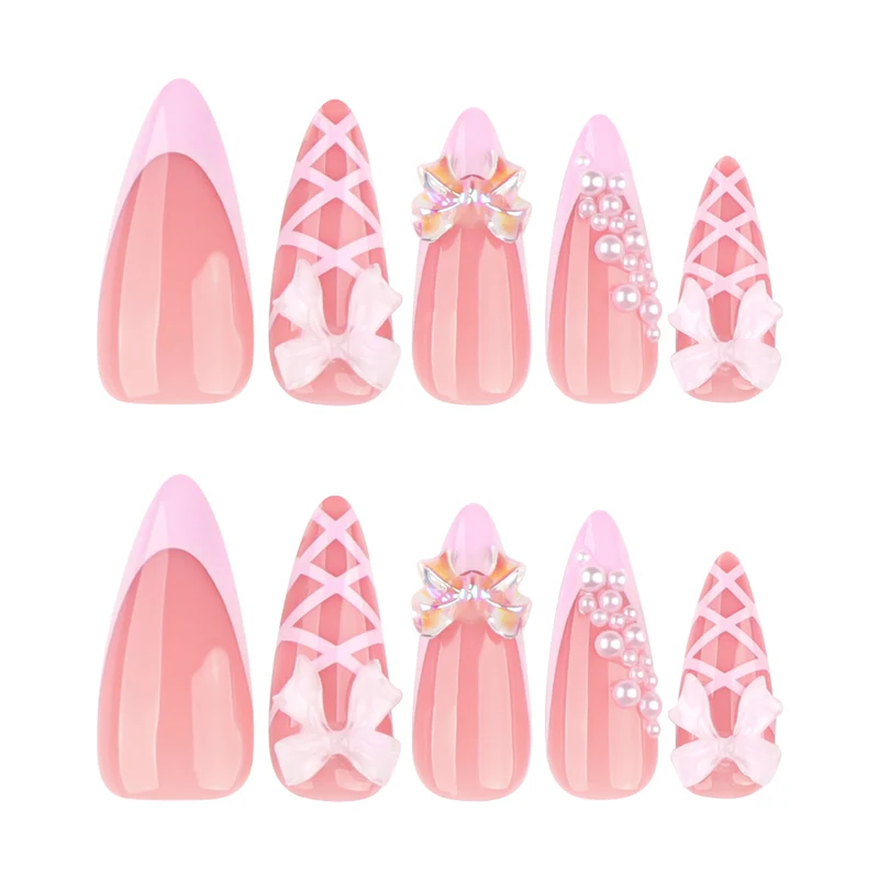 Artful stiletto nails with glitter and bow decoration Stornfield