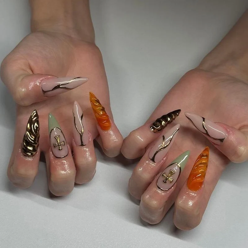 Artful stiletto nails with glitter and motif decorations Stornfield