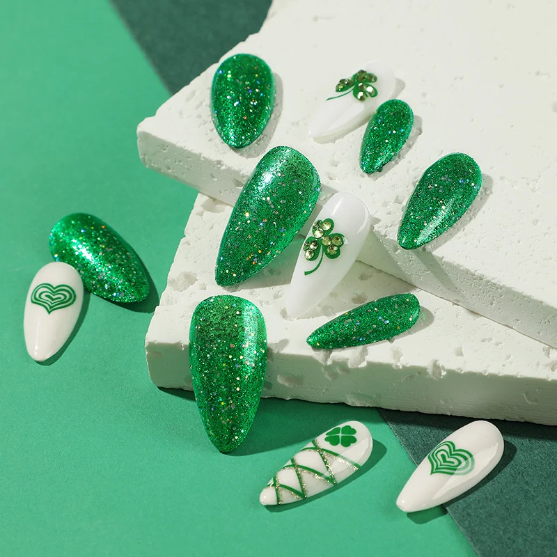 Artistic Stiletto Nails with Glitter and Clover Leaf Designs Stornfield