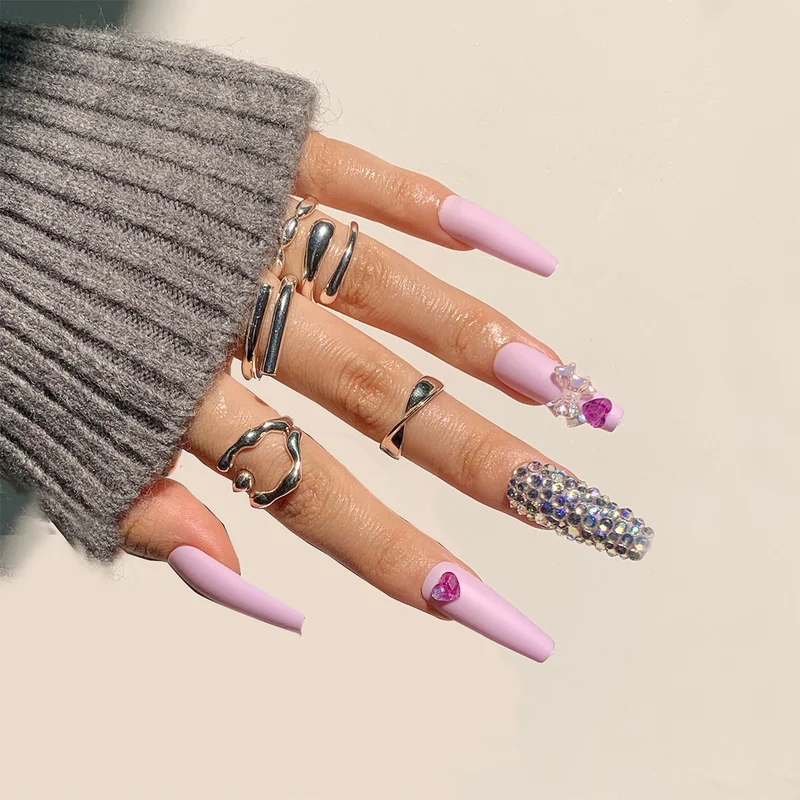 Artistic Stiletto Nails with Glitter and Flower Decorations Stornfield
