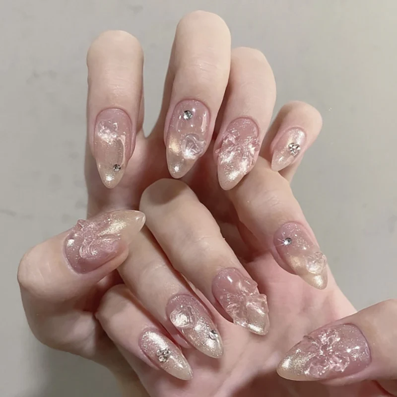 Artful stiletto nails with floral design and glitter accents Stornfield