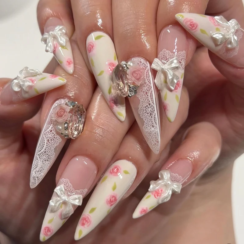 Artful stiletto nails with floral accents and glitter accents Stornfield