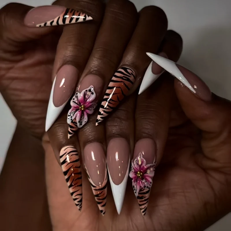 Artful stiletto nails with floral and animal design Stornfield
