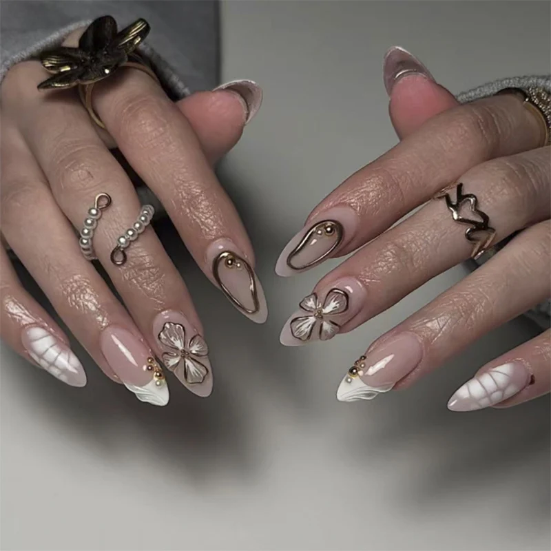 Artful stiletto nails with floral and shimmering decor Stornfield