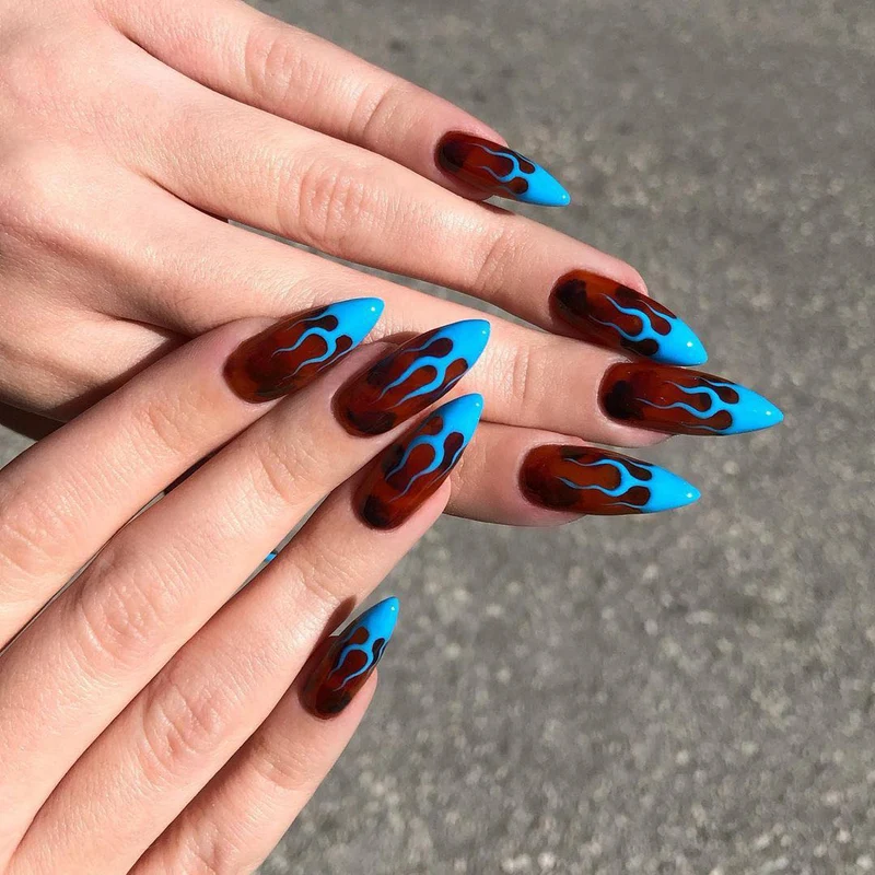 Artistic stiletto nails with extravagant flame pattern Stornfield