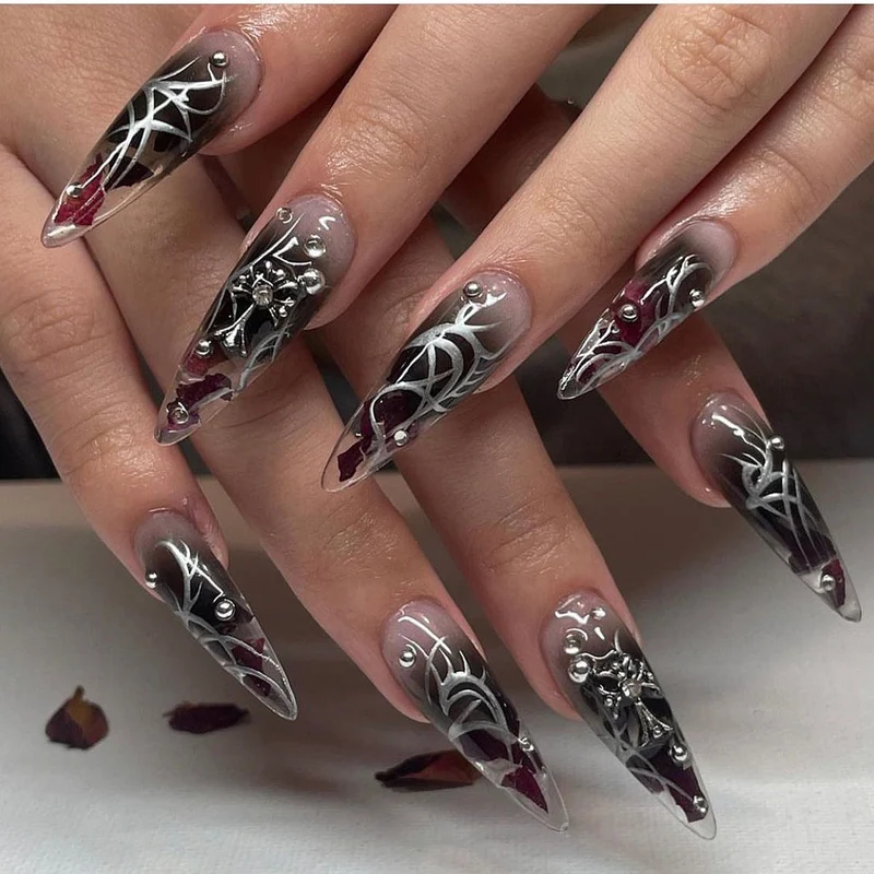 Artful stiletto nails with elegant decoration and modern accents Stornfield