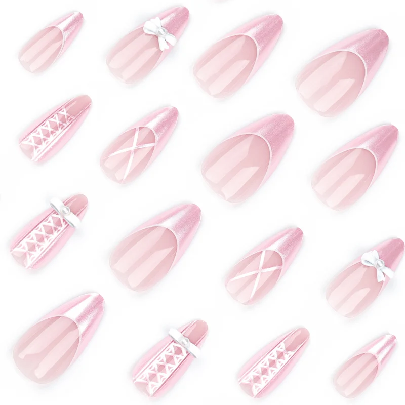 Artistic stiletto nails with elegant pearl and bow accents Stornfield