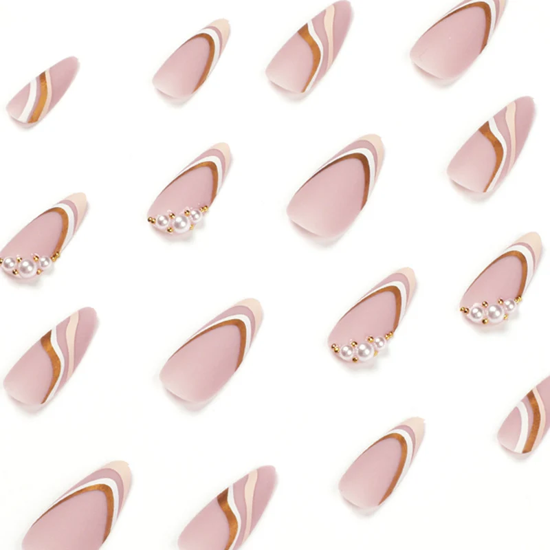 Artful stiletto nails with elegant gold and white accents Stornfield