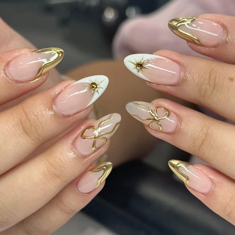 Artistic stiletto nails with elegant gold accents Stornfield