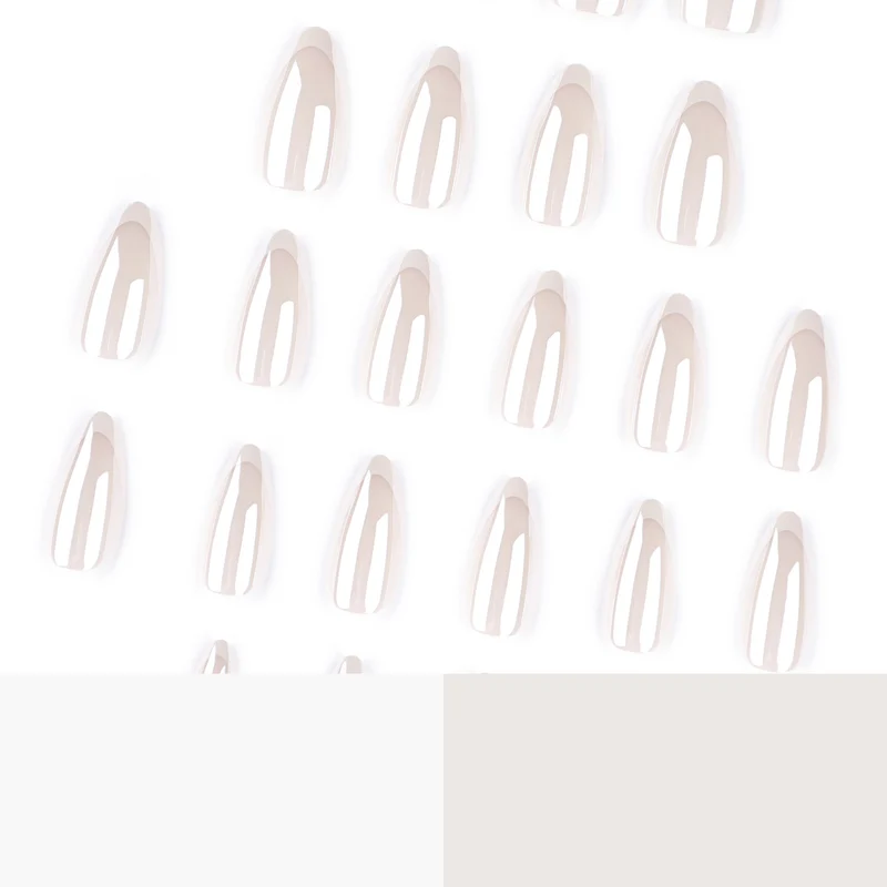 Artistic stiletto nails with elegant French tip embellishments Stornfield