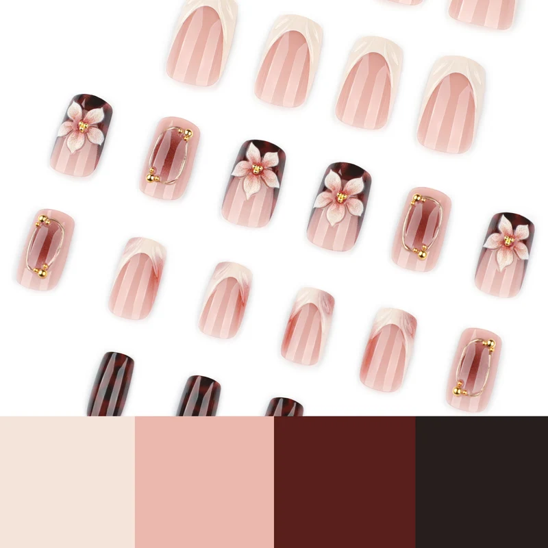 Artistic stiletto nails with elegant floral design and glitter effects Stornfield