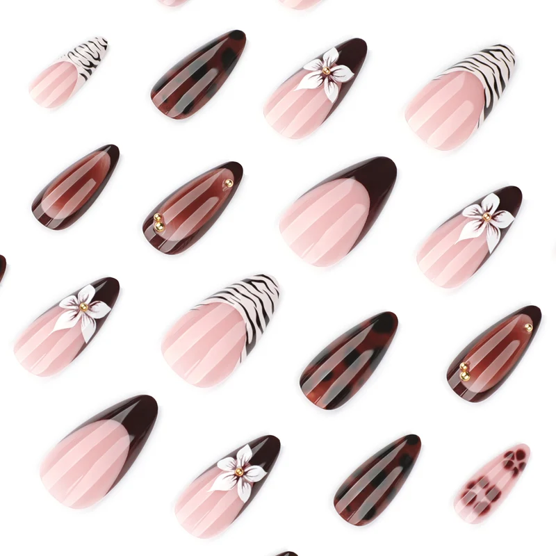 Artistic stiletto nails with elegant floral designs and glitter accents Stornfield