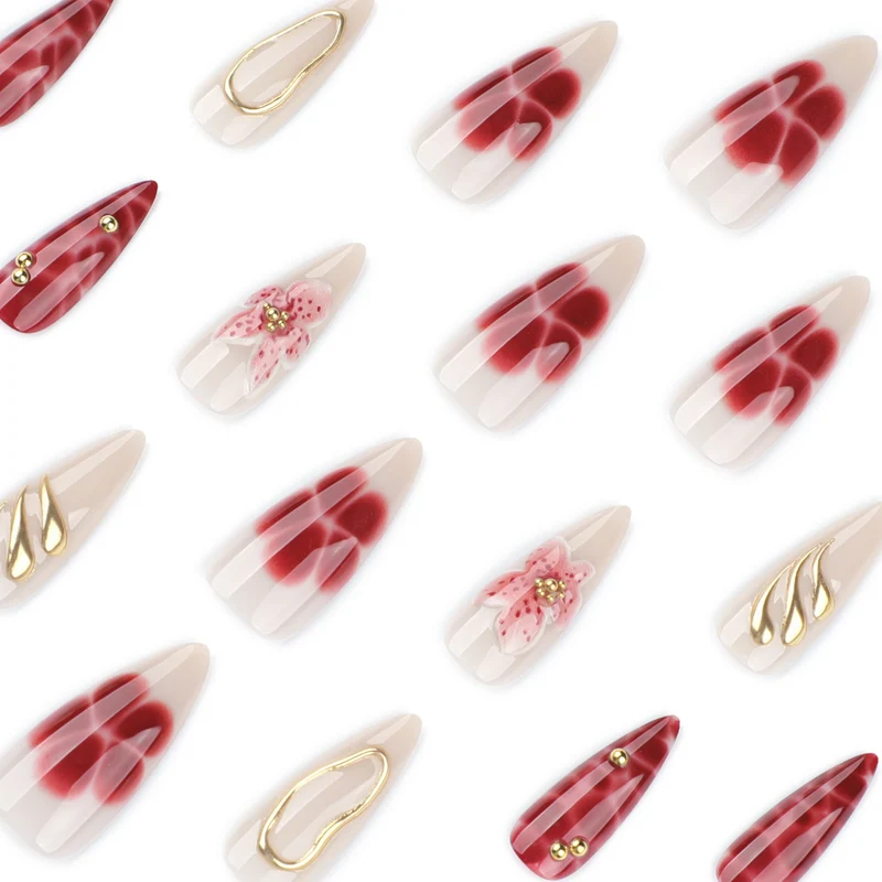 Artful stiletto nails with elegant floral designs and glitter accents Stornfield