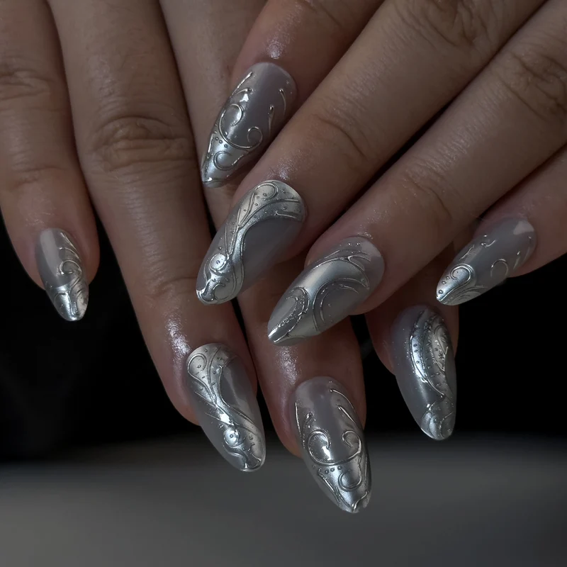 Artistic stiletto nails with elegant silver design Stornfield