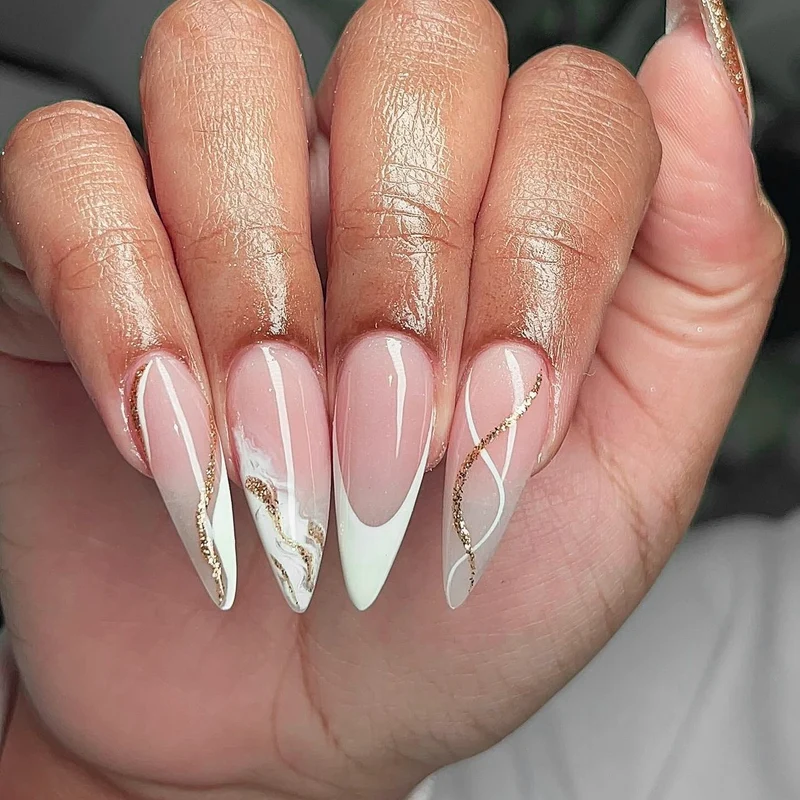 Artful stiletto nails with elegant marble and glitter design Stornfield
