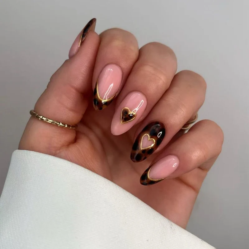 Artful stiletto nails with elegant heart design Stornfield