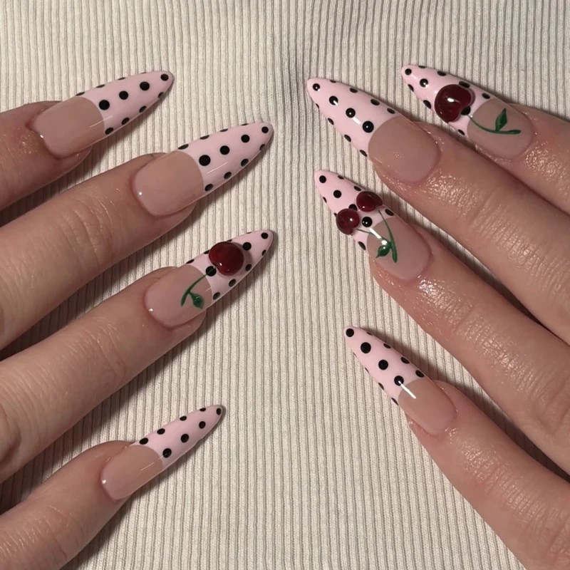 Artful stiletto nails with elegant floral design and glitter details Stornfield