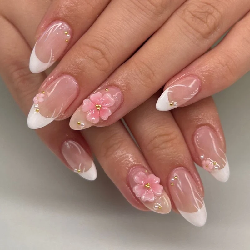 Artful stiletto nails with elegant floral design and glitter details Stornfield