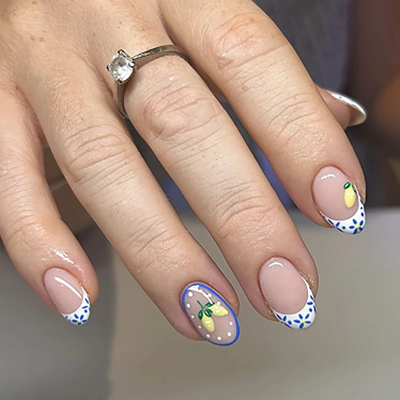 Artful stiletto nails with elegant floral design and glitter details Stornfield