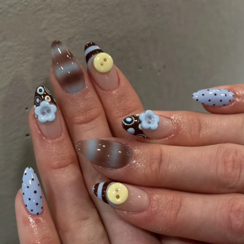 Artful stiletto nails with elegant floral design and glitter details Stornfield