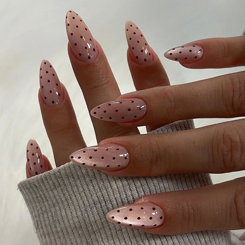 Artful stiletto nails with elegant floral design and glitter details Stornfield