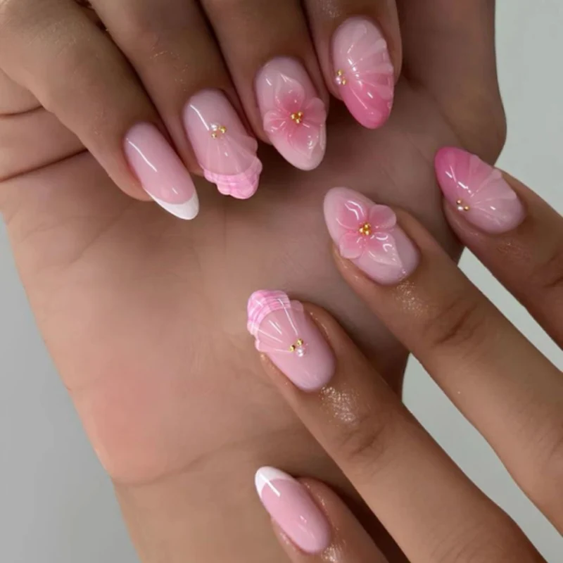 Artful stiletto nails with elegant floral design and glitter details Stornfield