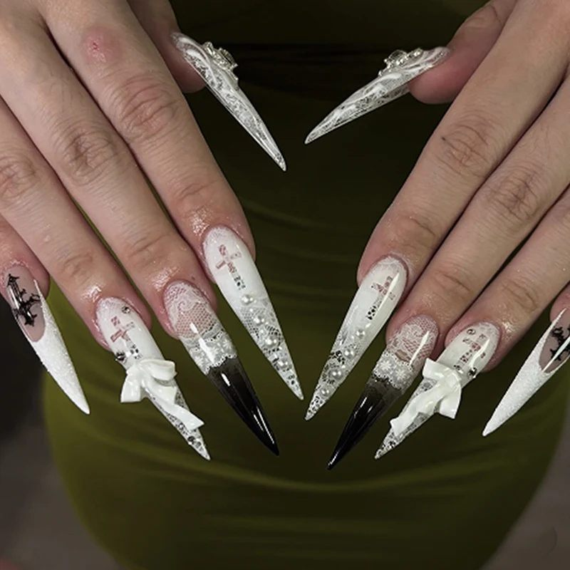 Artful stiletto nails with unique 3D elements and glitter accents Stornfield