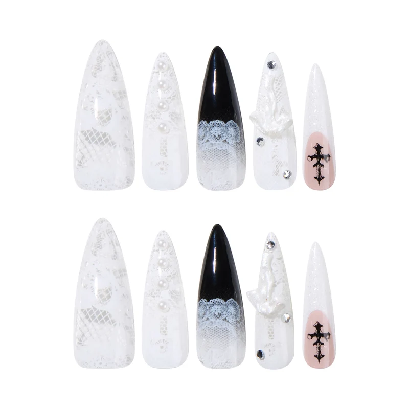 Artful stiletto nails with unique 3D elements and glitter accents Stornfield