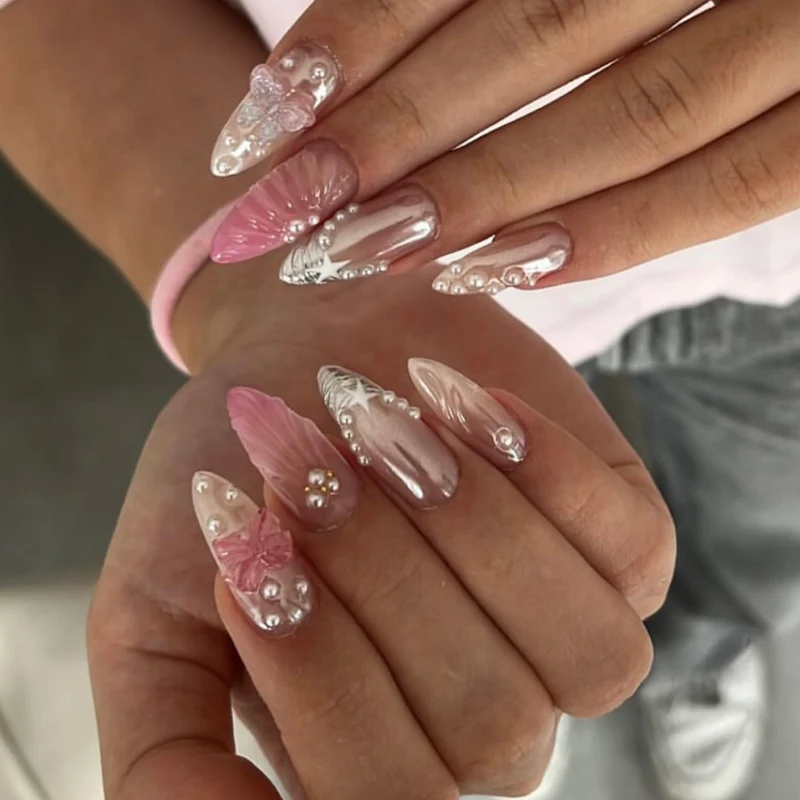 Artful stiletto nails with floral and glitter accents Stornfield