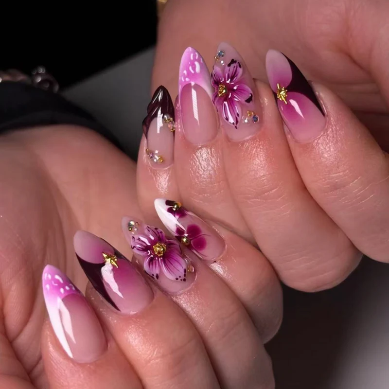 Artful stiletto nails with blooming design and glitter accents Stornfield