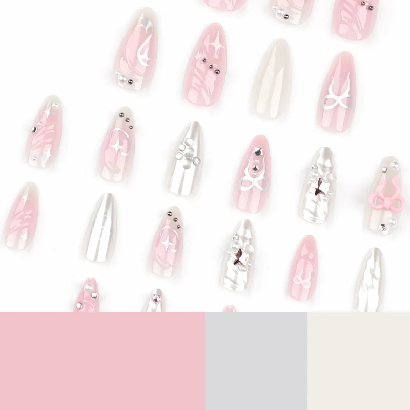Artful stiletto nails in an elegant design with creative embellishments Stornfield