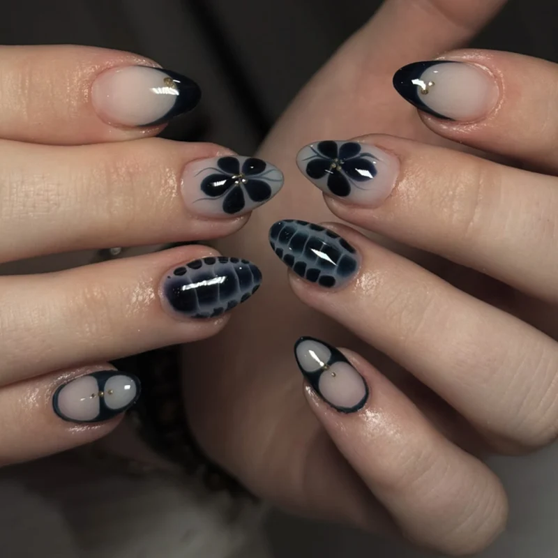 Artful nail art in elegant stiletto design with floral accents Stornfield