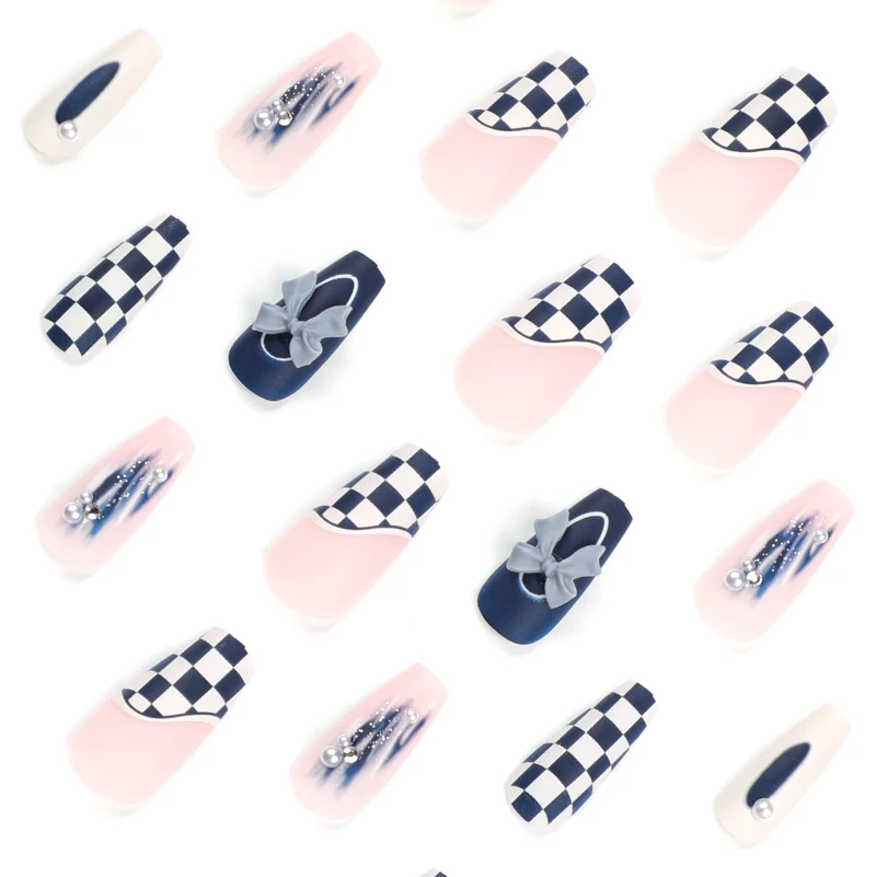Artful nail decoration with bows and plaid pattern Stornfield