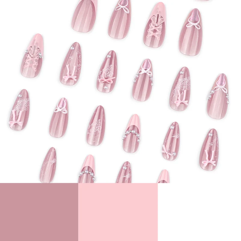 Artful nail extensions with delicate bow motifs Stornfield