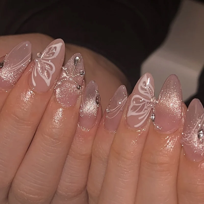 Artful nail extensions with delicate flower and glitter accents Stornfield