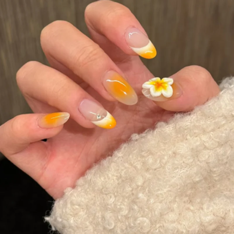 Artful nail extensions with delicate ombre effect and floral accents Stornfield
