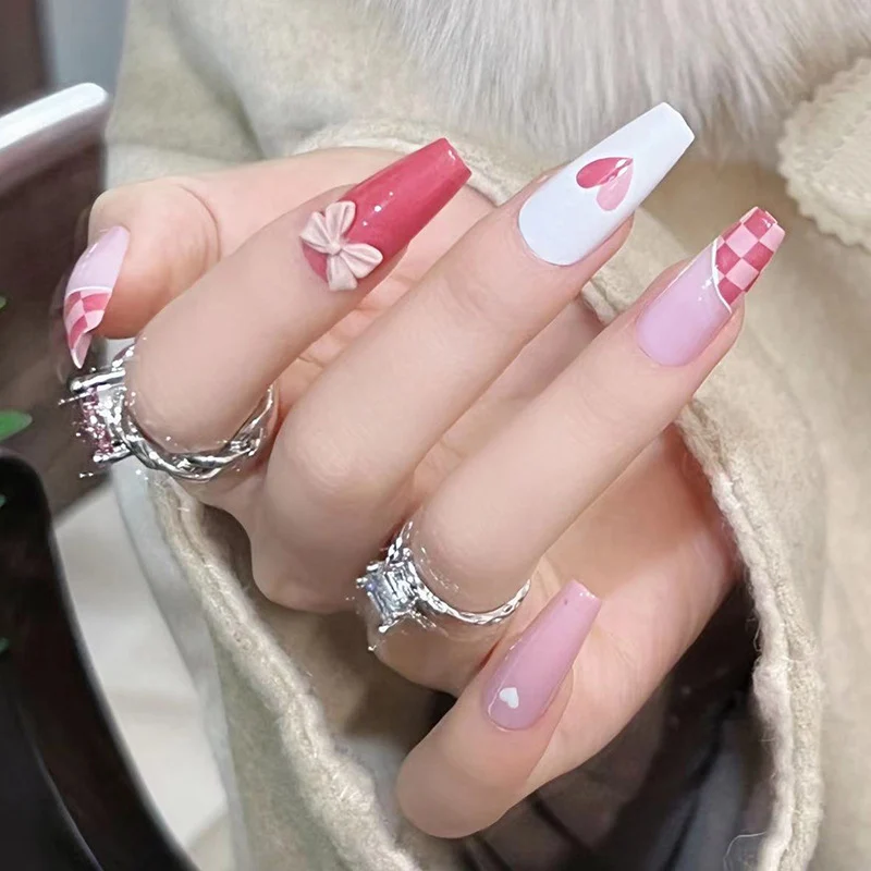 Artful nail extensions with playful designs and romantic accents Stornfield