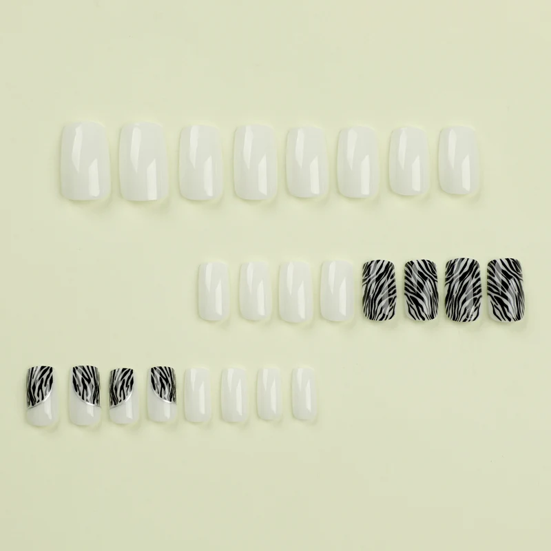 Artful nail extensions with stylish zebra pattern Stornfield