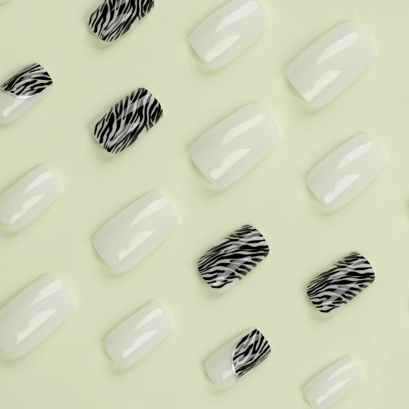 Artful nail extensions with stylish zebra pattern Stornfield