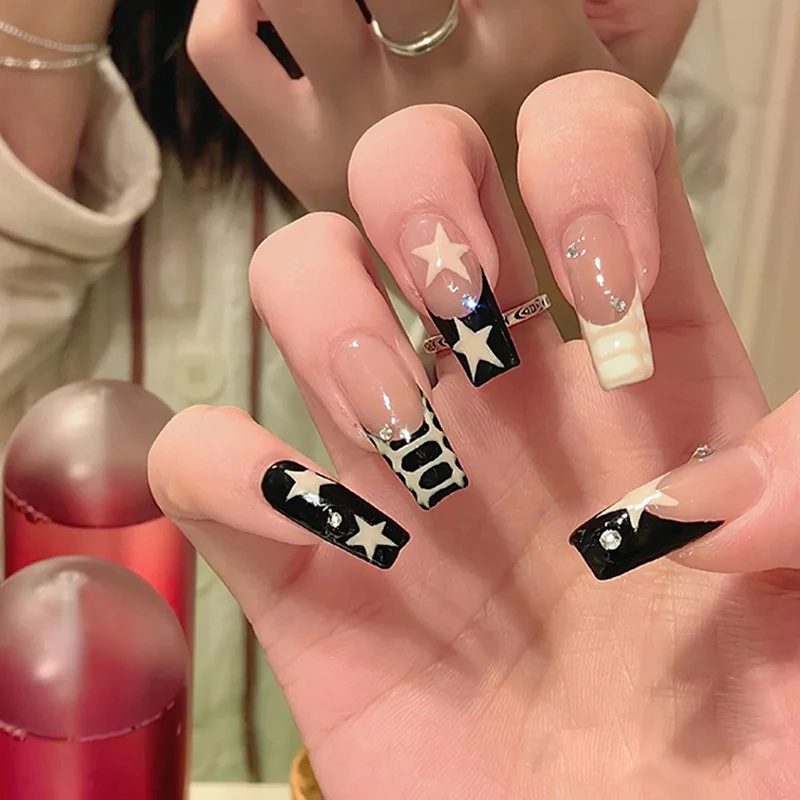 Artistic Nail Extensions with Star and Animal Design Stornfield