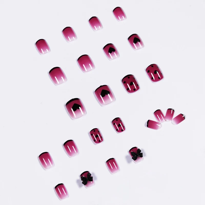 Artistic nail extensions with cute bow and heart designs Stornfield