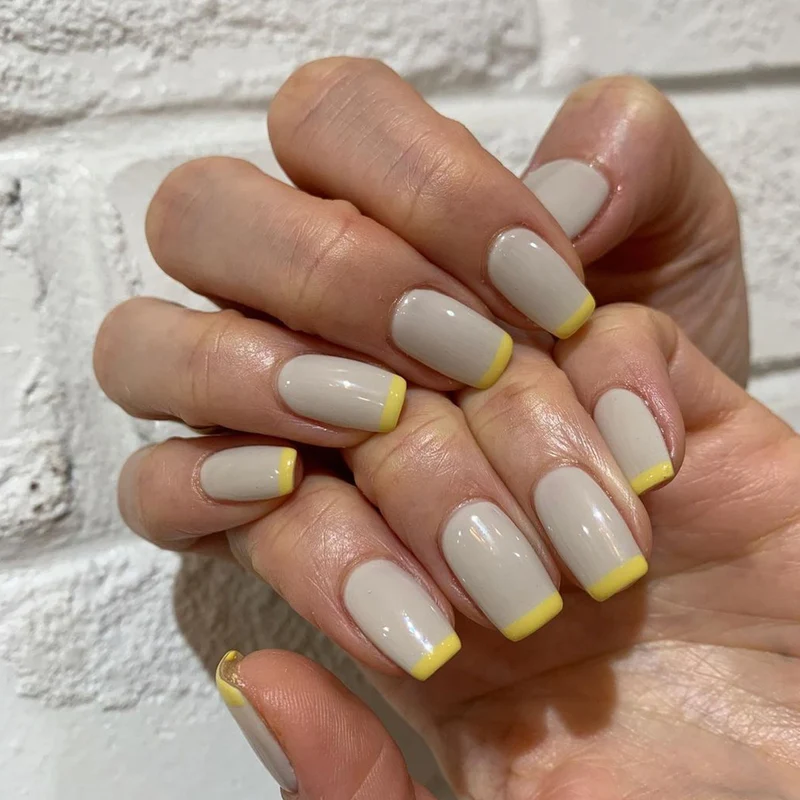 Artistic nail extensions with modern French-tip design Stornfield