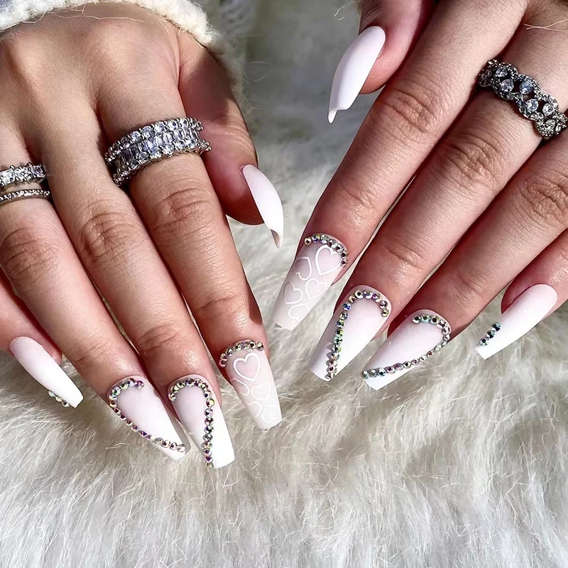 Artful Nail Extensions with Heart Design and Glitter Accents Stornfield